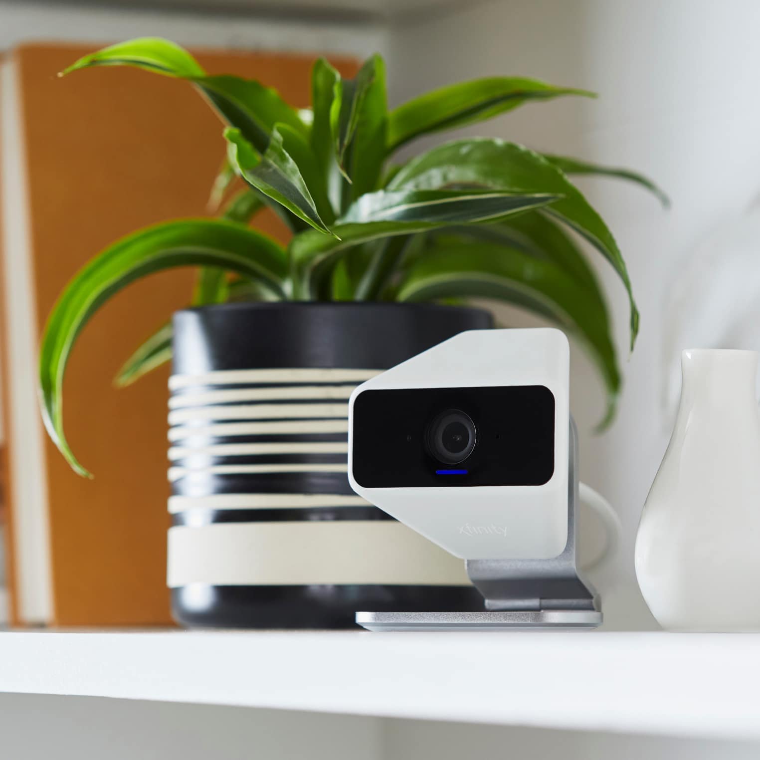 A security camera that can be used indoors or out door on shelf inside